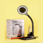 MagniGlow lamp with adjustable magnifying glass