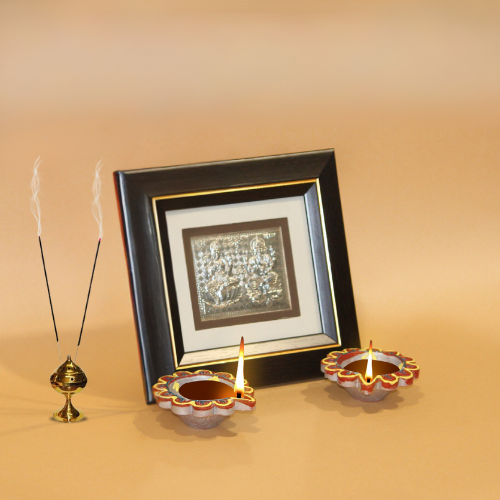 silver frame -goddess Laxmi and lord Ganpati